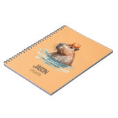 オレンジを載せたかわいいカピバラと子供の名前 ノートブック (左側)