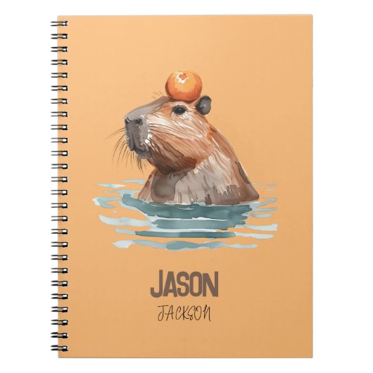 オレンジを載せたかわいいカピバラと子供の名前 ノートブック (正面)