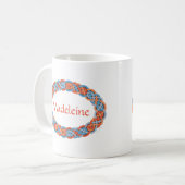 オレンジアンドブルーオーバルケルト結び目模様縁どトリステリオン コーヒーマグカップ (正面左)