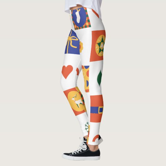 オレンジカスタムブルーグリーンのクリスマスブランド レギンス (左)