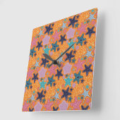 オレンジカラフル色の背景のヒトデ。 スクエア壁時計 (傾斜)