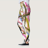 オレンジグリーンブルーブラックデザインの渦巻き レギンス (左)