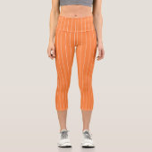 オレンジシンプル色のストライプ背景に白色の カプリレギンス (正面)