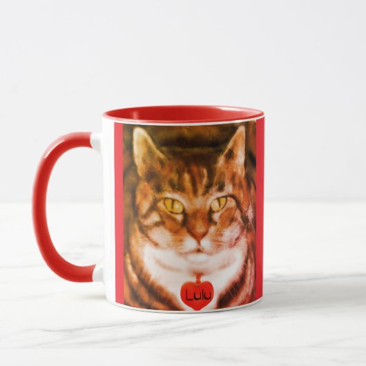 オレンジストライプの猫 赤い縁取り マグカップ (左)