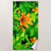 オレンジフラワー《写真》ぼけ味サニー ビーチタオル (正面)