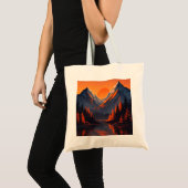 オレンジ色に燃える夕焼けの山並みとその水面反射 トートバッグ (正面(商品))