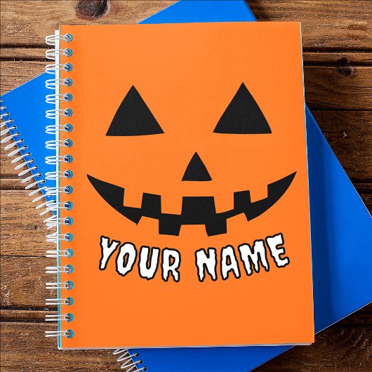 オレンジ色のかぼちゃのハロウィーン 名前入り ノートブック