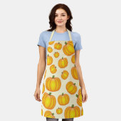 オレンジ色のカボチャのパターン エプロン (着用した状態)