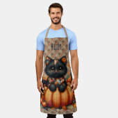 オレンジ色のカボチャの上の黒猫　秋の模様のクッションケット エプロン (着用した状態)