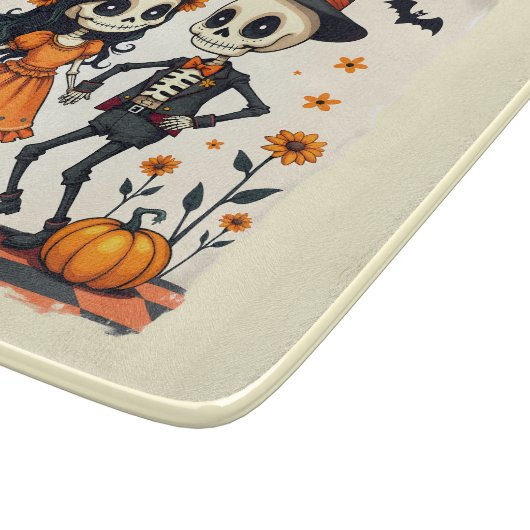 オレンジ色のキュートなハロウィンスケルトンカップル カッティングボード (角)
