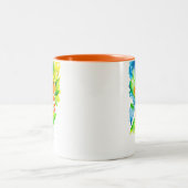オレンジ色のクンクアットフルーツアートの水色 ツートーンマグカップ (中央)