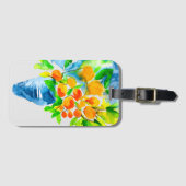 オレンジ色のクンクアットフルーツアートの水色 ラゲッジタグ (正面横)