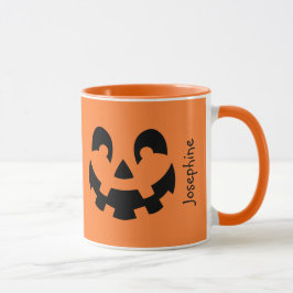 オレンジ色のハロウィンにシンプルな黒いカボチャの顔 マグカップ