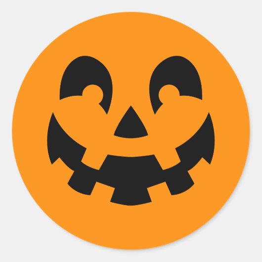 オレンジ色のハロウィンにシンプルな黒いカボチャの顔 ラウンドシール (正面)