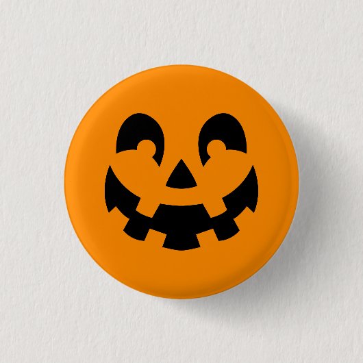 オレンジ色のハロウィンにシンプルな黒いカボチャの顔 缶バッジ (正面)