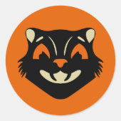 オレンジ色のハロウィンにヴィンテージスタイルの黒猫の顔 ラウンドシール (正面)