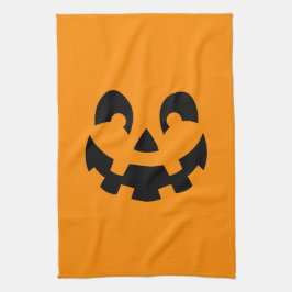 オレンジ色のハロウィンシンプルな黒いカボチャの顔 キッチンタオル