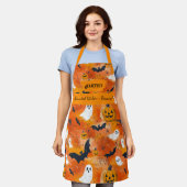 オレンジ色のハロウィーン(幽霊、カボチャ、こうもり) エプロン (着用した状態)