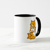 オレンジ色のバナナを食べる面白い猫 ネコのかわいいキャラクター マグカップ (正面右)