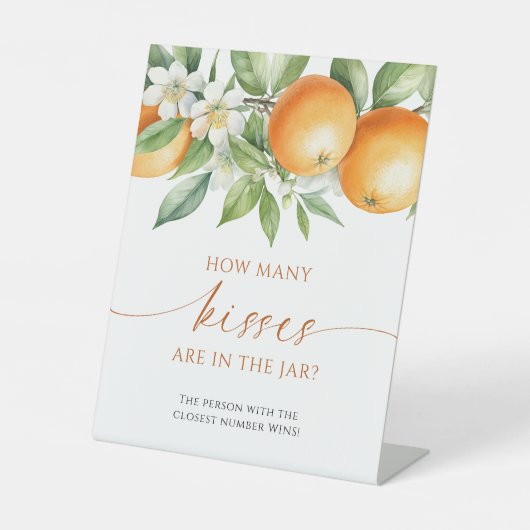 オレンジ色のフローラ瓶の中にキスが何個あるか 台座サイン (正面)