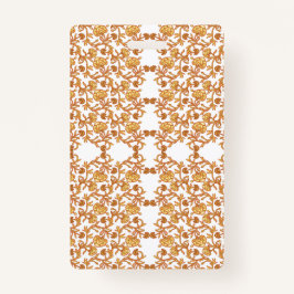 オレンジ色のモチフリースを使用した対称花パターン バッジ