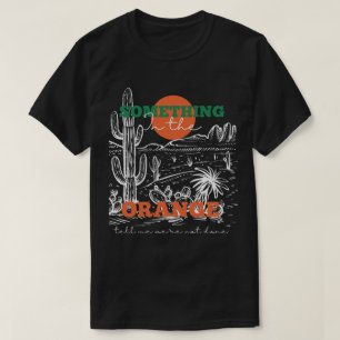 オレンジ色の何かが私に私たちは終わっていないことを告げる Tシャツ