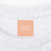 オレンジ色の子供がアイロンを衣類に付ける ラベル (貼付)