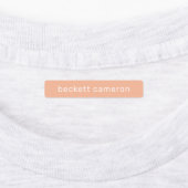 オレンジ色の子供がアイロンを衣類に付ける ラベル (貼付)