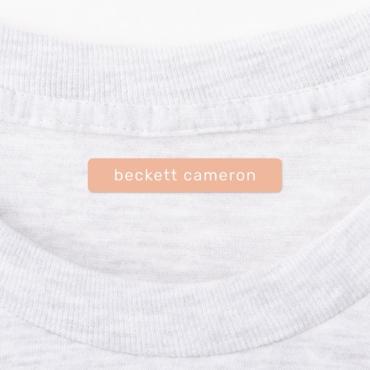 オレンジ色の子供がアイロンを衣類に付ける ラベル (貼付)