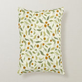 オレンジ色の果実葉とクリームのパターン。 アクセントクッション (正面(垂直))