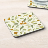オレンジ色の果実葉とクリームのパターン。 コースター (左側)