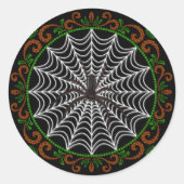 オレンジ色の緑の白いクモの巣と黒いクモ ラウンドシール (正面)