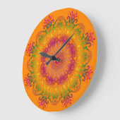 オレンジ色の背景にエスニックフローラマンダラ。 ラージ壁時計 (傾斜)