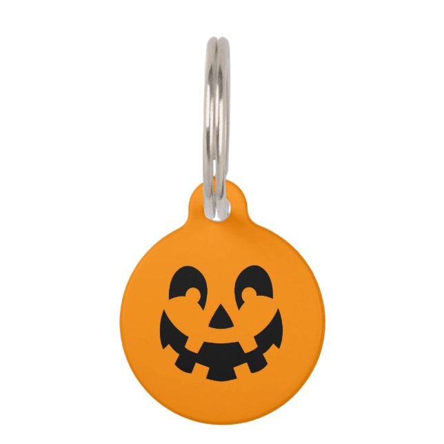 オレンジ色の背景に黒のハロウィンのかぼちゃのスマイル顔 ペット　ネームタグ (正面)