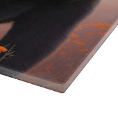 オレンジ色の花を咲かせた黒熊 カッティングボード (角)