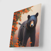 オレンジ色の花を咲かせた黒熊 スクエア壁時計 (傾斜)