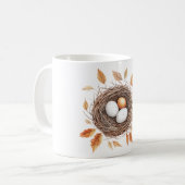 オレンジ色の葉と鳥の巣の中の卵 コーヒーマグカップ (正面左)