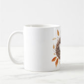 オレンジ色の葉と鳥の巣の中の卵 コーヒーマグカップ (左)