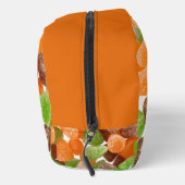 オレンジ色の赤いガムキャンディを振りかける砂糖モノグラム ドップキット (右)