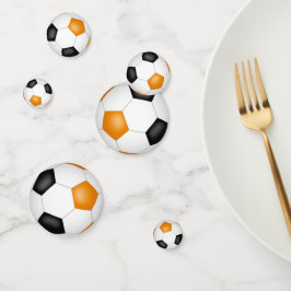 オレンジ色の黒いサッカーボール子供たち10代のスポーツパーティー コンフェッティ