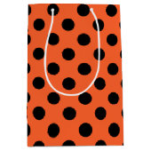 オレンジ色の黒い水玉模様 ミディアムペーパーバッグ (正面)
