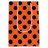 オレンジ色の黒い水玉模様 ミディアムペーパーバッグ (裏面)