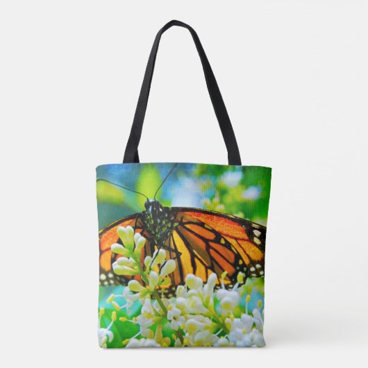 オレンジ（昆虫）オオカバマダラ、モナークバタフライホワイトフラワーフォトはっきりした トートバッグ (裏面)