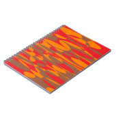 オレンジ、赤、茶色のエリプティカル ノートブック (左側)