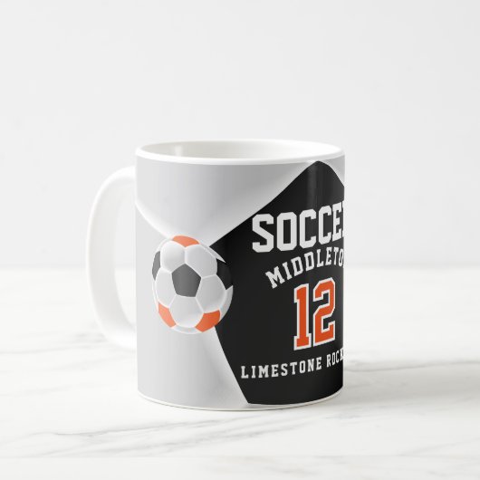 オレンジ、黒、白 ⚽ サッカー コーヒーマグカップ (正面左)