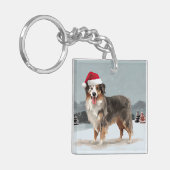 オーストラリアン・シェパードの犬の雪のクリスマス キーホルダー (正面左)