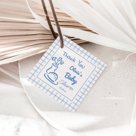 オーブンのシャワーに手で引かれた青いパン男の赤ちゃん フェイバータグ