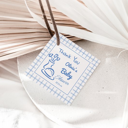 オーブンのシャワーに手で引かれた青いパン男の赤ちゃん フェイバータグ