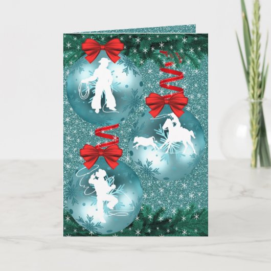 カウボーイとカウガールがロープで牛を捕まえる青いホリデーカード シーズンカード (正面)