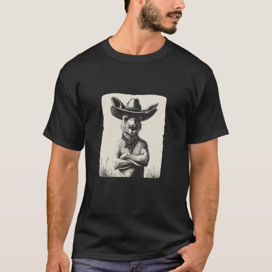 カウボーイの帽子のコスチュームを着たカンガルーの面白いデザイン Tシャツ (正面)